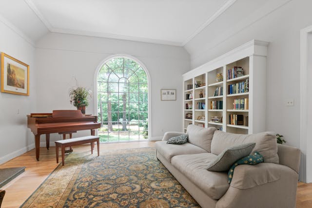 gray-couch-near-brown-wooden-piano