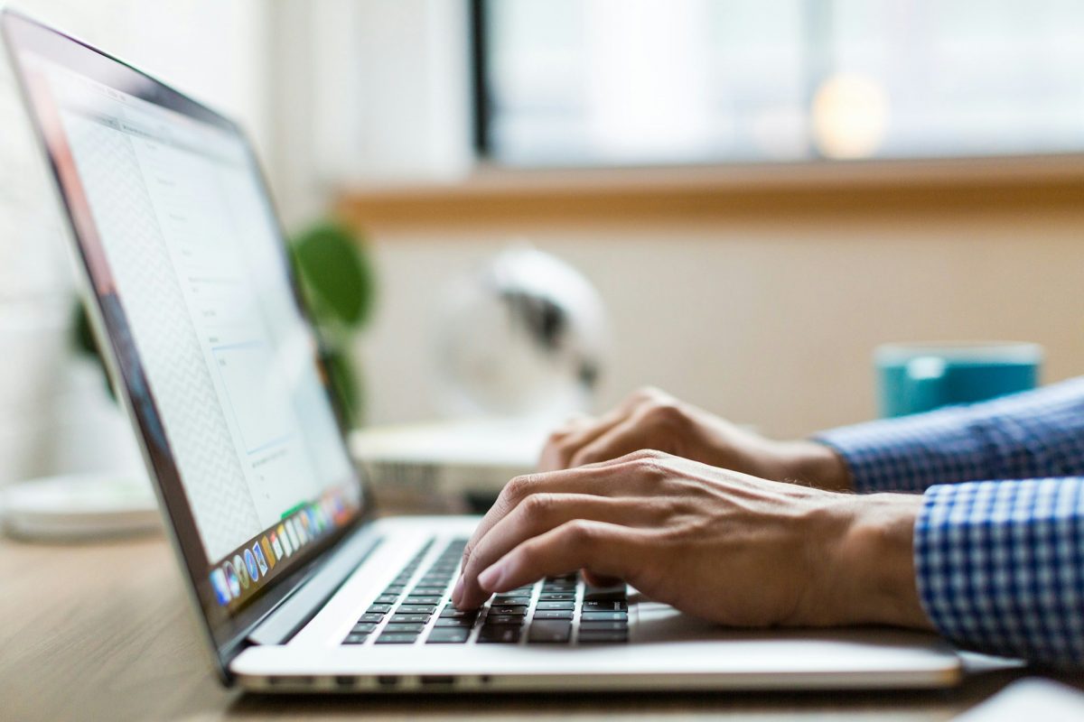 person-typing-on-silver-macbook